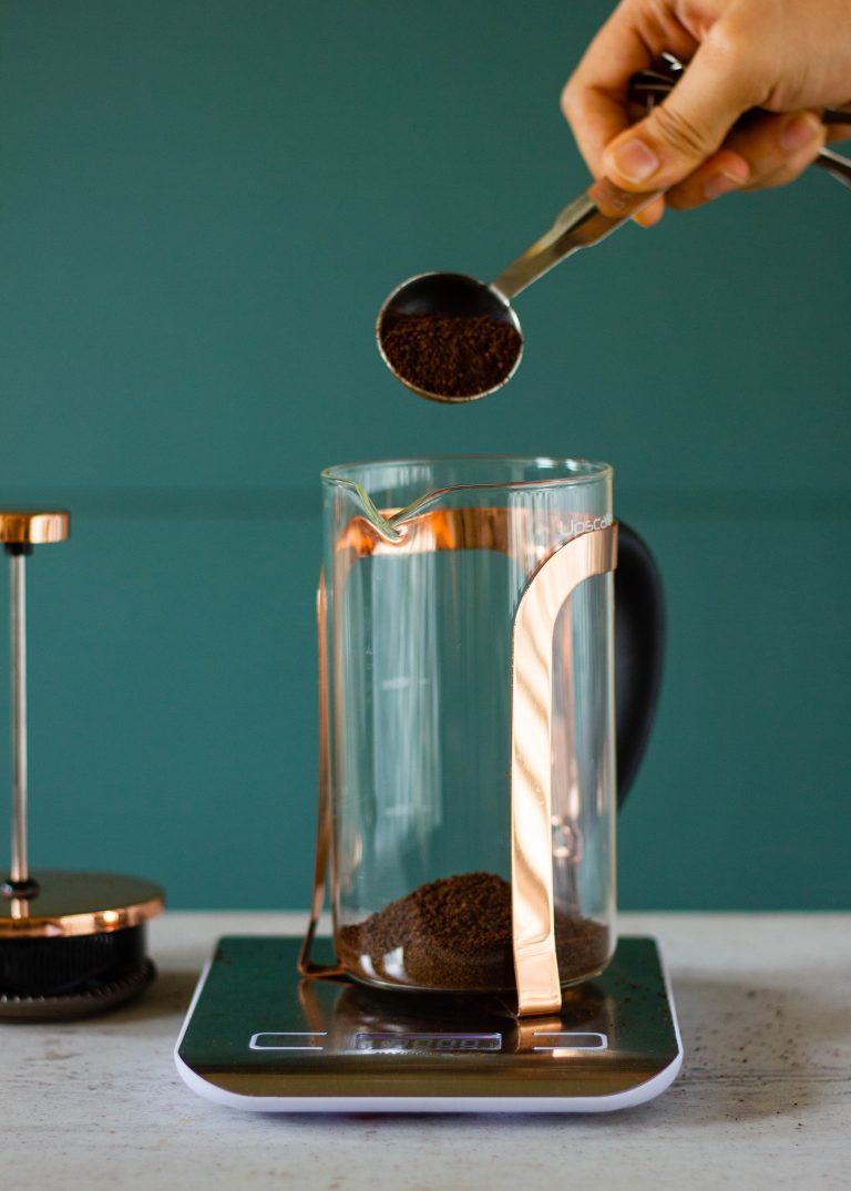 Adding coffee to a French Press
